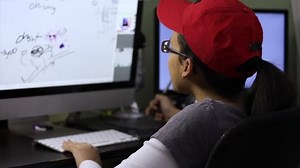 clip-1024394069-teenage-girl-drawing-using-ditigal-tablet-on