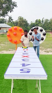 Who's the first of the balloon-popping competition? | The Village Game