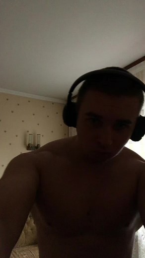 Muscle Flexing Workout Showcase in a Living Room