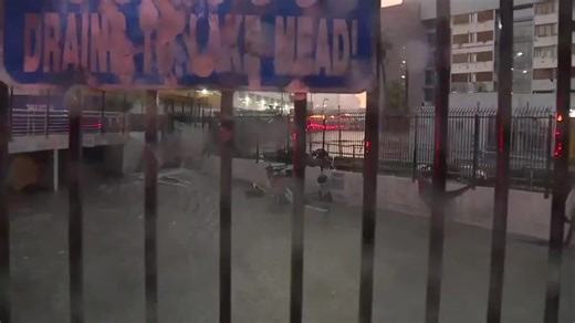 Fire crews attempt to rescue person swept up in floodwater