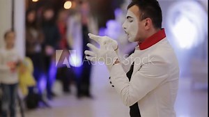 mime shows different emotions with his hands and face