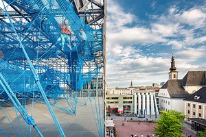 numen/for use installs climbable 'tube' overlooking the city of linz, austria