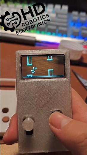Arduino-Konsole mit einem ESP32-S3, Joystick, Tasten, und einem transparent-blauen OLED-Display