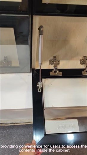 Drop down gas spring for kitchen cabinet