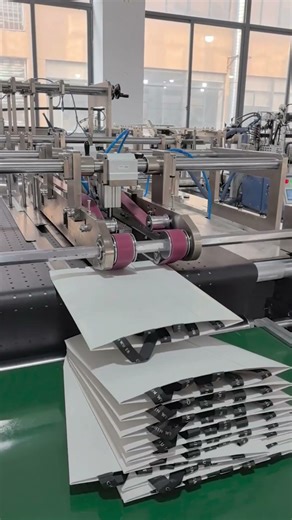 High-end paper bag machine with no waistline.Automatic handle pasted is achieved.#paperbagmachine