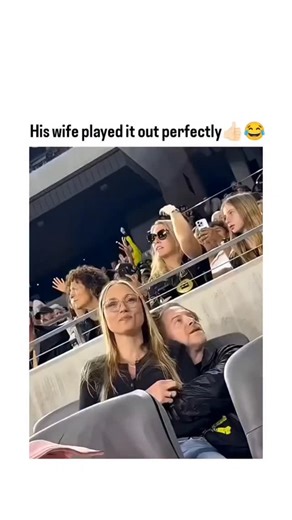 meme matrix on Instagram: "The post shares a 22-second clip from a recent LA Galaxy football match at BMO Stadium, showing actor Seth Green awkwardly hiding his face on the jumbotron while his wife, Claire Forlani, waves enthusiastically and laughs along. Posted by [ awkwardgoogle ] on 13 January 2026, the video captures a classic celebrity embarrassment moment, with the caption praising Forlani's perfect, composed playfulness amid Green's visible discomfort. Amassing over 96,000 likes and 7.5 m
