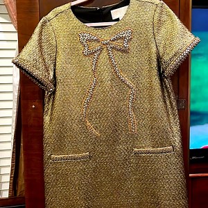 Beautiful gold metallic dress with bow like new war one time