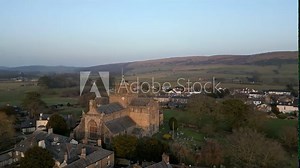 Slow Motion clip of the Cumbrian medieval village of Cartmel showing the historic Cartmel Priory at sunset