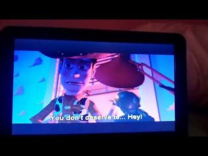 Woody Knocks Buzz Out of the Window.