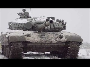 Russian main battle tank T-72 firing in winter conditions