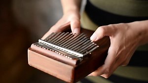 Playing On African Instrument Kalimba Mbira Stock Footage Video (100% Royalty-free) 1074955328 | Shutterstock