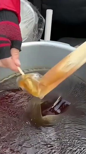 the process of making candy made from melted sugar which is then allowed to thicken and sold
