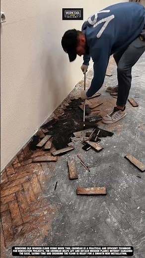 Removing old wooden floor using work tool Crowbar