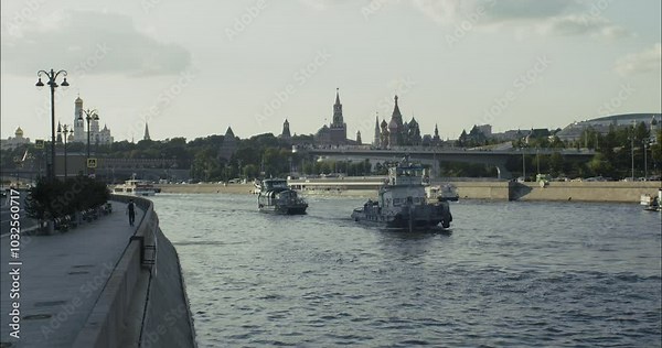 Moscow River with tourist boats, Kremlin view, and the Floating Bridge