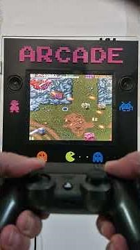 A custom IKEA-table arcade runs Out Zone using a Raspberry Pi, a PS4 controller, and an ESP32