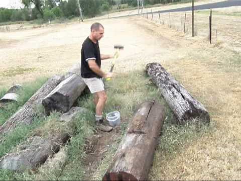 Log Splitting Demo using Wedges and a Sledge Hammer. Muscle power.
