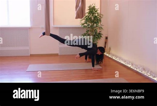 Bodyweight training. Handstand exercise. Woman doing flexibility physical therapy for posture muscle with fly yoga hammock support Stock Video Footage - Alamy