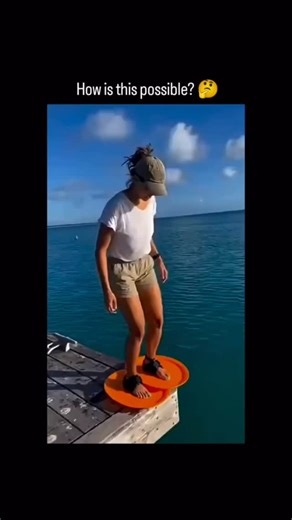 Unknown person | This Instagram reel features a 10-second Al-generated video of a woman striding across turquoise water using orange disc attachments on her... | Instagram