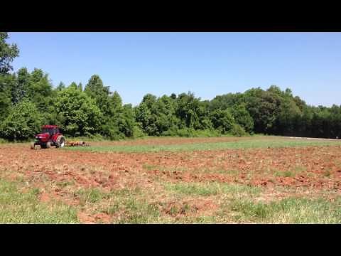 CaseIH 5140 pulling Amco F17 Bog Disc Harrow