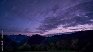 Twilight over beautiful wooded and hilly landscape, Dusk, transition from day to night