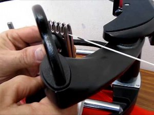 3) How to tighten up a clamp on a stringing machine