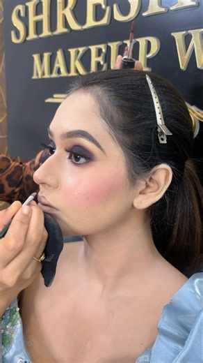 Smokey eyes in blue gown with messy advance hair bun #smokeyes #engagementbride #trendylook