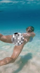 She Dives and Swims Under the Water