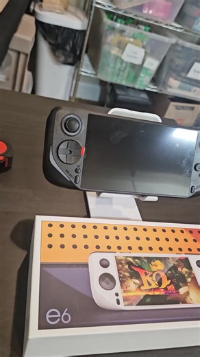 E6 handheld game console - a mini portable gaming device with a 5-inch HD screen. a 5000 mAh batterv, over 10,000 built-in classic retro games, 11 emulators. and 64GB of memory; perfect for travel, leisure, and stress relief, it's the perfect holiday gift