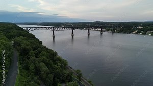 aerial footage of walkway over the hudson (railroad bridge converted to walking cycling pedestrian biking path part of empire state path and hudson valley rail trail) wide river crossing poughkeepsie Stock Video