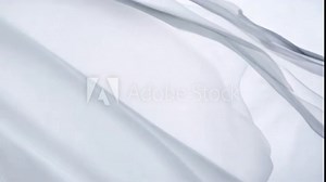 Translucent fabric flows softly, creating airy atmosphere with delicate layers that evoke sense of calm and elegance, showcasing light texture and sheer beauty perfect for design.