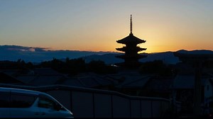 Download timelapse kyoto city aerial skyline view to ancient Yasaka pagoda building and Kyoto Tower at the back in higashiyama, Kyoto old town with sunset sky for free