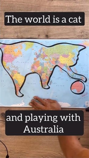 World map is a cat playing with Australia #world #map #play #cat #australia #mapping #funny #viral