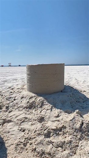 Sand Castle University on Instagram: "Sand Castle work out This is the process to create the base of most sand sculptures. We layer sand and water then compact it into this cylinder. After, we carve it into whatever we want! #asmr #sand #sandart #sandcastle #satisfying #gulfshores #sandsculpture"