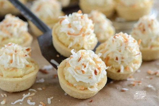 These Coconut Cream Pie Cookie Cups from @The Novice Chef Blog are the perfect bite size combination of two classic desserts — coconut cream pie and sugar cookies! Recipe: https://bit.ly/32fUBKB | Dixie Crystals