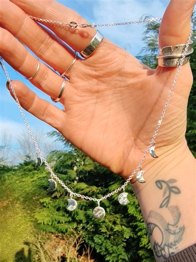The sunlight glinting off these Moons tells me that SPRING.IS.COMING! My Moon phase choker is available on my website always handcrafted by me using recycled sterling silver 👩‍🏭🌜 #moonphase #moonlover #handmadejewellery #sterlingsilver