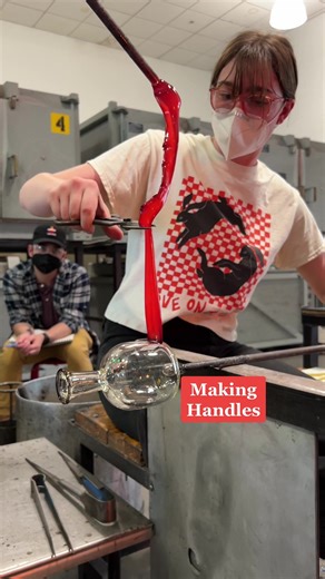 Showing how to make handles, by my TA Gemma! We didn’t know it was her first time gaffing one! Gaffing = making at the bench) #glassblowing #learnontiktok #tiktokpartner #hotglass #glassblower #BigComfy #BigComfy
