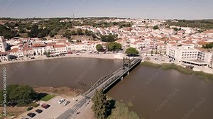 Bascule bridge over the Sado river in Alcacer do Sal, Portugal. Picturesque aerial cityscape of the traditional Portuguese city