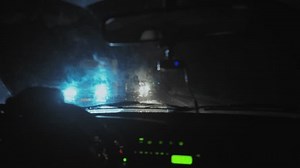 Driving A Vehicle In The Dark. Poor Visibility, Dangerous Driving Fatigue, Stress, Attention. Driver In A Car Driving At Night The Light Of Oncoming Cars Blinds His Eyes.