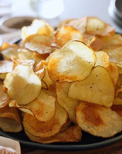 Making homemade potato chips is so much easier than you think! All you need are potatoes, oil, and salt for crispy, golden-brown chips. | Preppy Kitchen