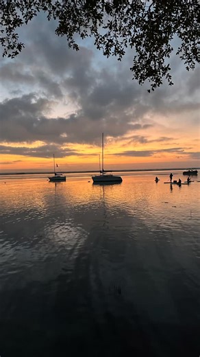 Sunrise over the Bacalar Lagoon! The Pretty Wild Travel club is off for a 3 day adventure in one of the most magical places. #travels #bacalarlagoon #over50 | Pretty Over Fifty