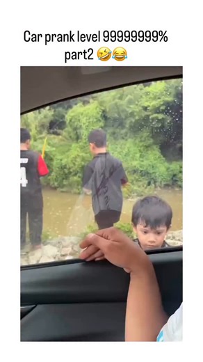 @brokethescroll on Instagram: "- The video depicts a staged fishing prank by adults near a river, using exaggerated movements with yellow rods to scare a young boy inside a parked car, who reacts with wide-eyed fear before covering his face, turning into a mix of distress and eventual relief. - Posted as “part 2” a account focused on sharing lighthearted video moments, it has exploded to 1.7 million views and 12,500 likes in under 24 hours, driven by the authentic, relatable portrayal of a child