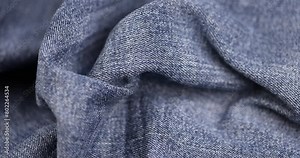 blue denim fabric for sewing clothes, new denim fabric from clothing jeans close-up