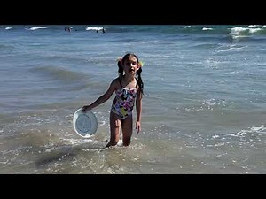 Kids are playing on the beach with sand and having fun