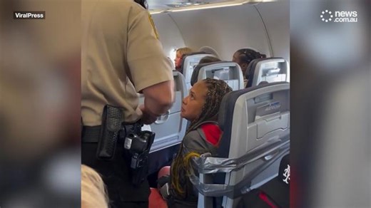 Shock moment ranting foul-mouthed passenger is strapped to seat with duct tape