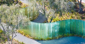 apple park's mirage sculpture takes shape as iridescent glass pillars winding through trees