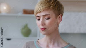 Close up view woman reduces thirst takes a sips drinking glass of natural or mineral water normalizing bowel function. Dehydration prevention, skin and health care, healthy life habit benefits concept