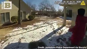 Footage from the Jonesboro Police Department in Arkansas shows officer Troy Ellison crawling onto the ice to save a child who had fallen through. | Breitbart