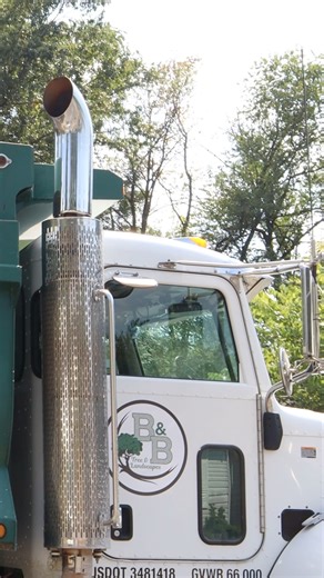 Everyone knows us for trees — now we’re movin’ earth too. Great to see our John Deere 325G and our new Peterbuilt dump truck put to good use on this backyard retaining wall project. | B&B Tree & Landscapes