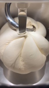 Brezen dough is LOW hydration and that can be really hard on mixers with its LONG mix time. But the @oonihq is handling it like it’s nothing and she’s popping her gum while she’s at it. (That’s the dough you hear, in tight formation due to low hydration, and the tension causes bubbles that POP! It’s delightful). Stay tuned for a @redstaryeast Brezen aka Pretzel aka Laugengebäck 🥨 video tutorial in the very near future! #laugengebäck #breze #brezen | Gesine BP