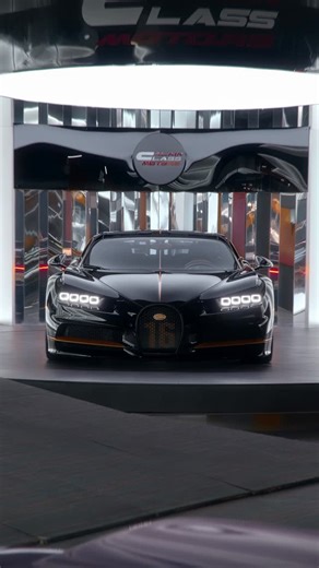 Al Ain Class Motors on Instagram: "𝐁𝐮𝐠𝐚𝐭𝐭𝐢 𝐂𝐡𝐢𝐫𝐨𝐧 Eight years of redefining what a hypercar could be, brought to a close in one final creation. Powered by the legendary W16 and producing 1,500 hp, this Chiron signs off in Nocturne Black with Copper accents, paired with a Beluga Black | Copper Leather interior. The last of its kind — not replaced, not repeated, just remembered. #Bugatti #Chiron #alainclassmotors"